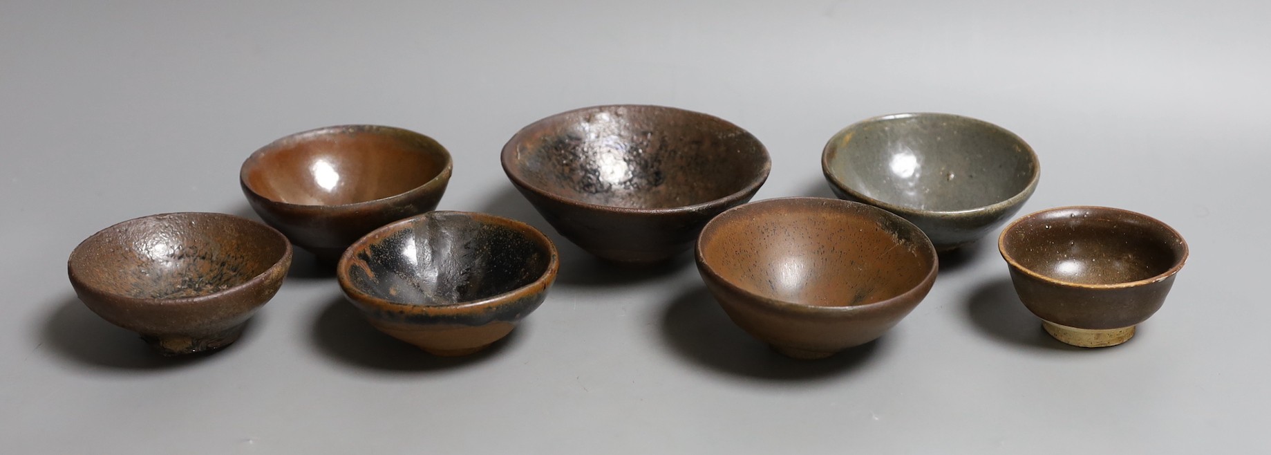 A group of Chinese Jian ware tea bowls, Song dynasty, largest 11.5 cms diameter, 7cm to 11.4cm diameter